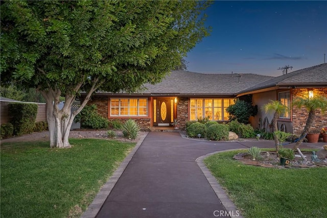 130 Mariposa Way, Brea, CA 92823 - ranch-style home with stucco siding, a shingled roof, and a front yard