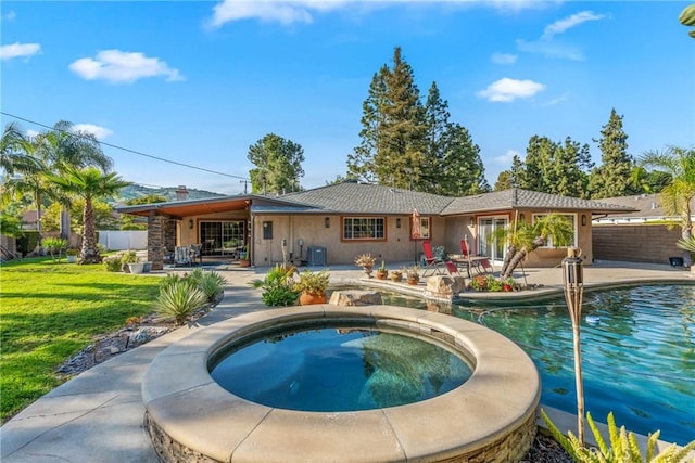 130 Mariposa Way, Brea, CA 92823 - rear view of property featuring a lawn, fence, a patio area, and an in ground hot tub