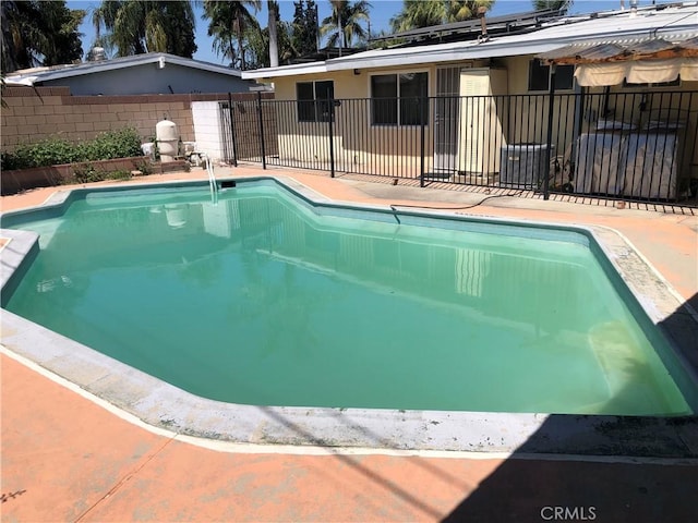 view of pool featuring fence, central AC, and a fenced in pool