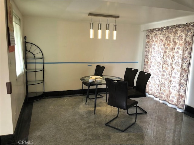 sitting room featuring baseboards and a wealth of natural light