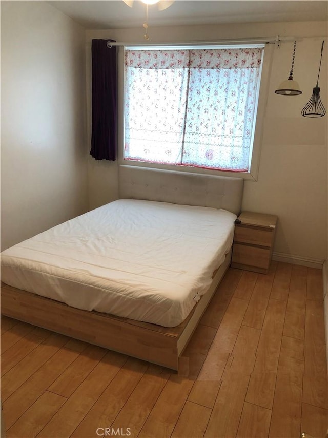 bedroom with light wood-type flooring
