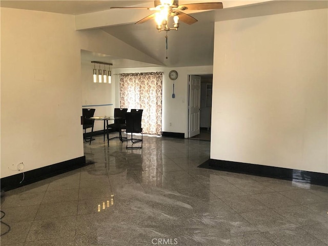 unfurnished room featuring baseboards, ceiling fan, granite finish floor, and vaulted ceiling