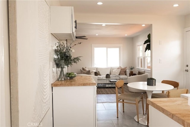 3222 E 10th St, Long Beach, CA 90804 - kitchen featuring recessed lighting, white cabinetry, wooden counters, light tile patterned floors, and open floor plan