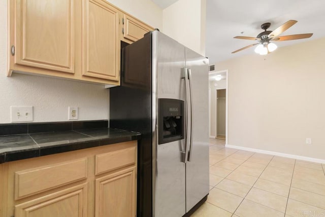 18614 Caminito Cantilena Unit 324, San Diego, CA 92128 - kitchen with stainless steel refrigerator with ice dispenser, light brown cabinets, dark countertops, and ceiling fan