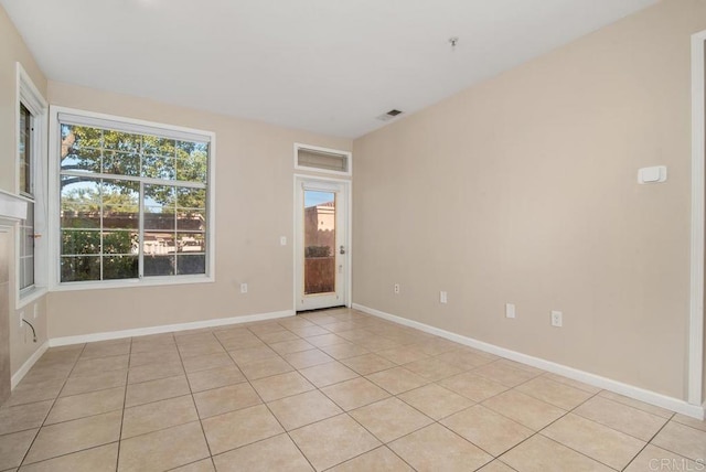 18614 Caminito Cantilena Unit 324, San Diego, CA 92128 - unfurnished room featuring light tile patterned floors and baseboards