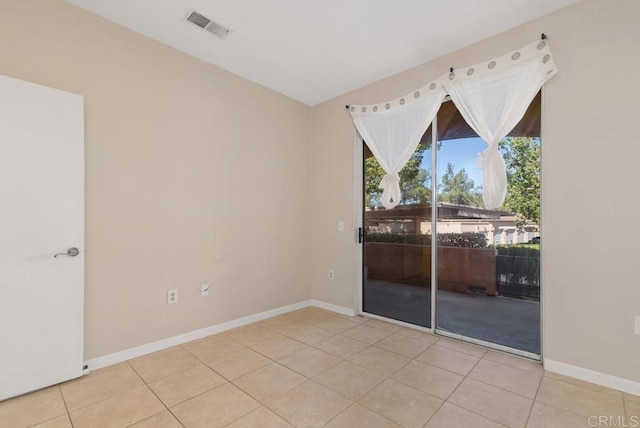 18614 Caminito Cantilena Unit 324, San Diego, CA 92128 - spare room with tile patterned flooring and baseboards