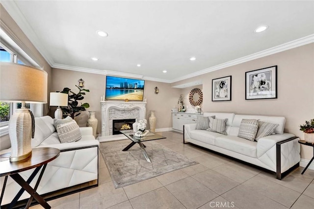 living area with crown molding, recessed lighting, a glass covered fireplace, baseboards, and light tile patterned flooring