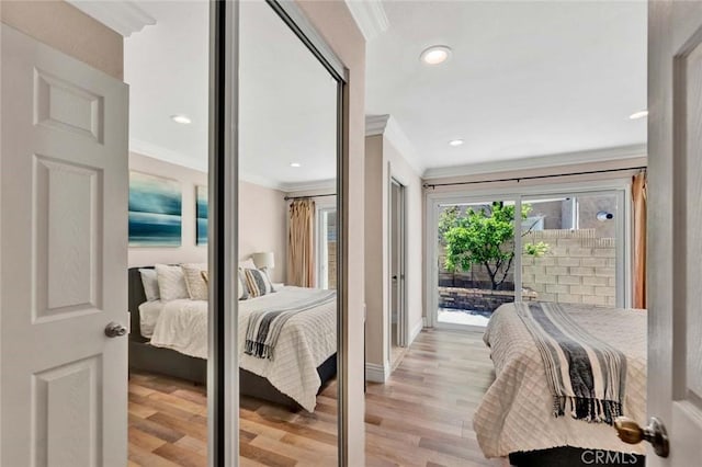 bedroom with crown molding, access to exterior, light wood-style floors, baseboards, and recessed lighting