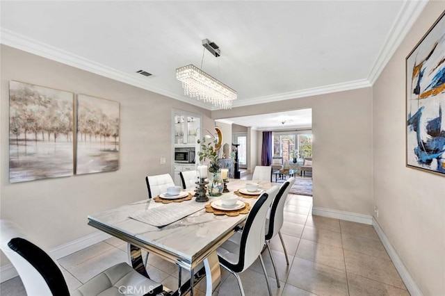 dining area featuring a chandelier, crown molding, baseboards, and light tile patterned floors