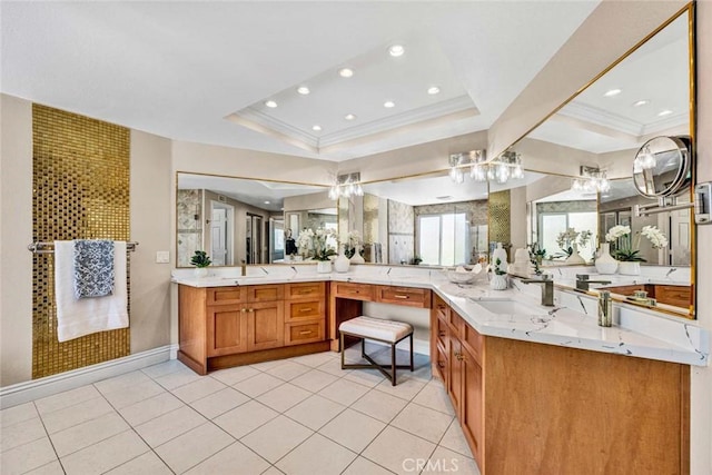 bathroom featuring a chandelier, a raised ceiling, recessed lighting, vanity, and tile patterned flooring