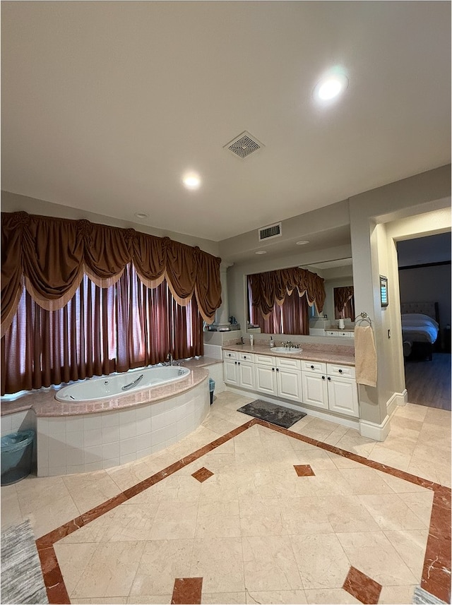 full bath with recessed lighting, visible vents, a garden tub, and vanity