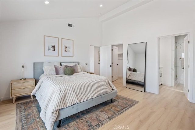bedroom featuring light wood-type flooring, vaulted ceiling, baseboards, visible vents, and recessed lighting