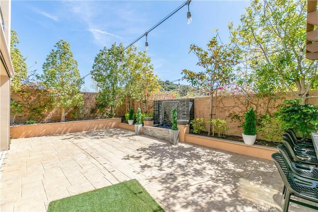 20512 W Esmeralda Ln, Porter Ranch, CA 91311 - fenced backyard with a patio area