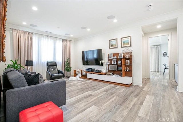 20512 W Esmeralda Ln, Porter Ranch, CA 91311 - living area with light wood-type flooring, ornamental molding, recessed lighting, and baseboards