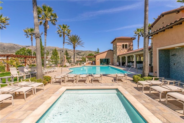 20512 W Esmeralda Ln, Porter Ranch, CA 91311 - community pool with a mountain view and a patio