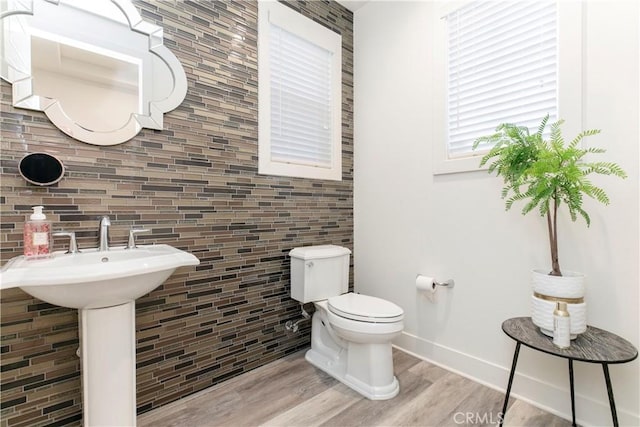 20512 W Esmeralda Ln, Porter Ranch, CA 91311 - half bath featuring tile walls, toilet, wood finished floors, and baseboards