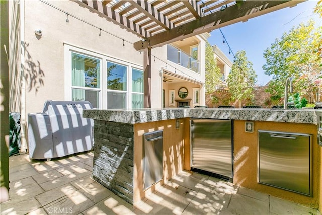 20512 W Esmeralda Ln, Porter Ranch, CA 91311 - view of patio / terrace with a pergola and an outdoor kitchen