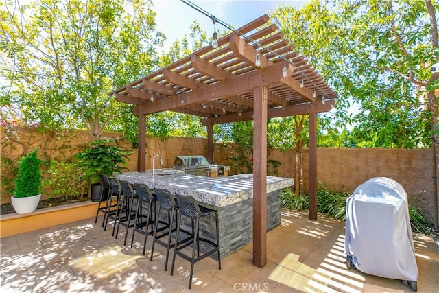 20512 W Esmeralda Ln, Porter Ranch, CA 91311 - fenced backyard with a grill, a pergola, and a patio