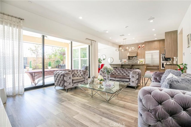 20512 W Esmeralda Ln, Porter Ranch, CA 91311 - living room with a chandelier, light wood finished floors, and recessed lighting