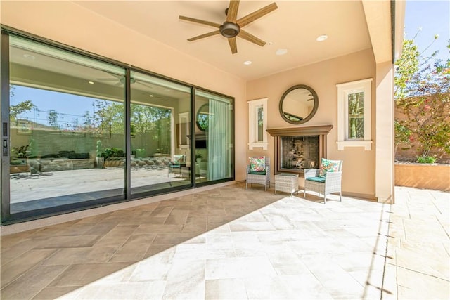 20512 W Esmeralda Ln, Porter Ranch, CA 91311 - view of patio / terrace featuring ceiling fan and exterior fireplace