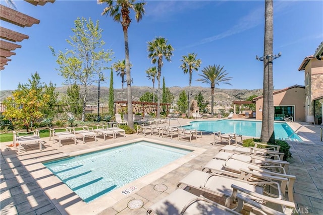20512 W Esmeralda Ln, Porter Ranch, CA 91311 - community pool featuring a mountain view and a patio