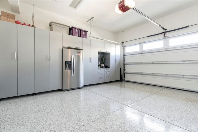 20512 W Esmeralda Ln, Porter Ranch, CA 91311 - garage featuring stainless steel refrigerator with ice dispenser and a garage door opener