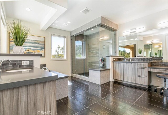 20512 W Esmeralda Ln, Porter Ranch, CA 91311 - full bath featuring healthy amount of natural light, decorative backsplash, a shower stall, vanity, and recessed lighting