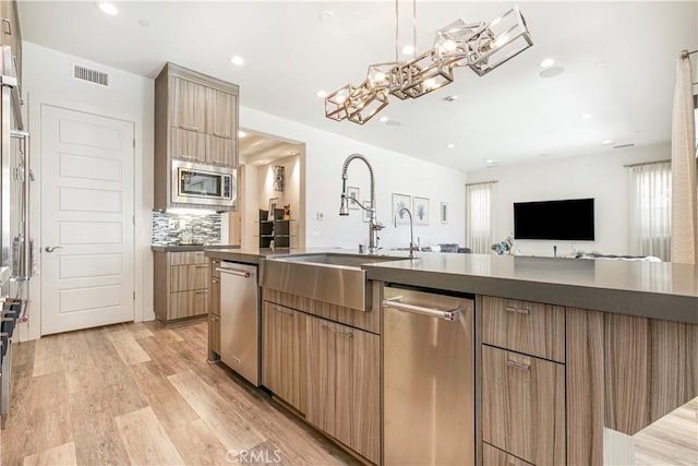 20512 W Esmeralda Ln, Porter Ranch, CA 91311 - kitchen with appliances with stainless steel finishes, a sink, dark countertops, recessed lighting, and modern cabinets
