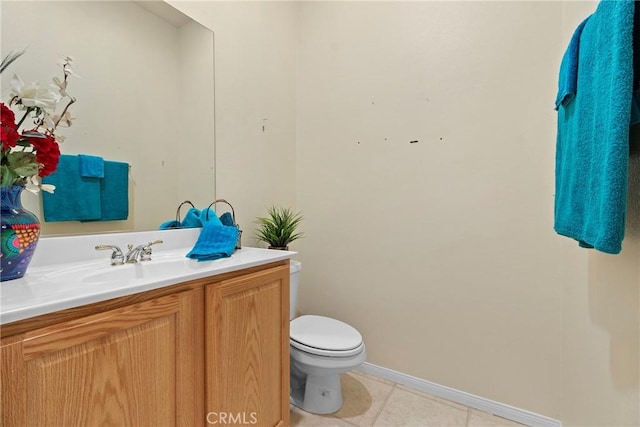 5536 Breckenridge Ave, Banning, CA 92220 - bathroom with vanity, toilet, baseboards, and tile patterned floors