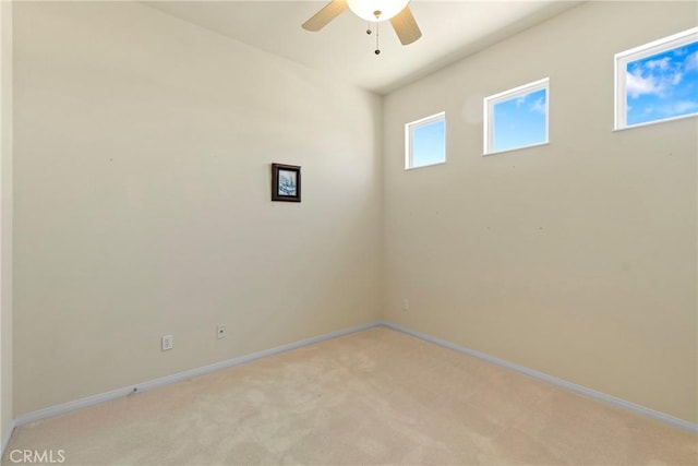 5536 Breckenridge Ave, Banning, CA 92220 - empty room featuring a ceiling fan, light colored carpet, and baseboards
