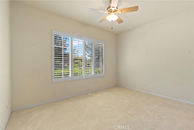 5536 Breckenridge Ave, Banning, CA 92220 - unfurnished room featuring light colored carpet, baseboards, and ceiling fan