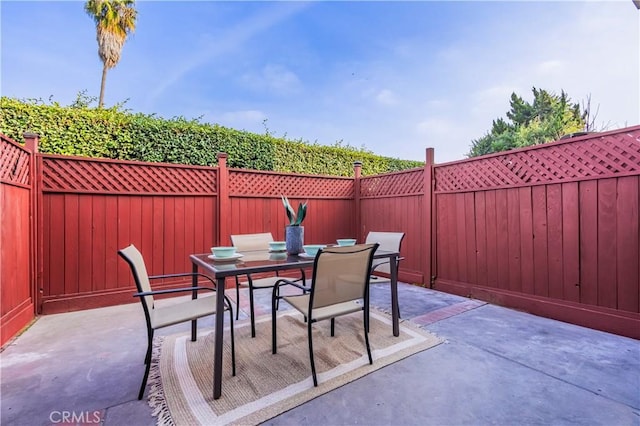 view of patio / terrace with a fenced backyard and outdoor dining space