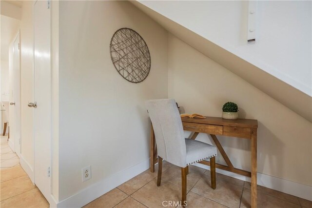 11249 Ferina St, Norwalk, CA 90650 - office space featuring tile patterned flooring, vaulted ceiling, and baseboards