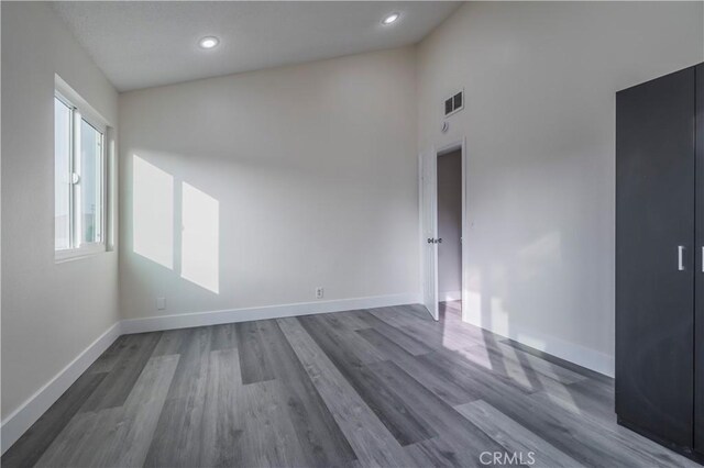 11249 Ferina St, Norwalk, CA 90650 - spare room with baseboards, wood finished floors, and recessed lighting