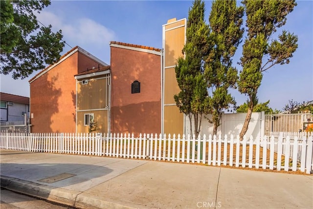 11249 Ferina St, Norwalk, CA 90650 - view of property exterior with a fenced front yard and stucco siding