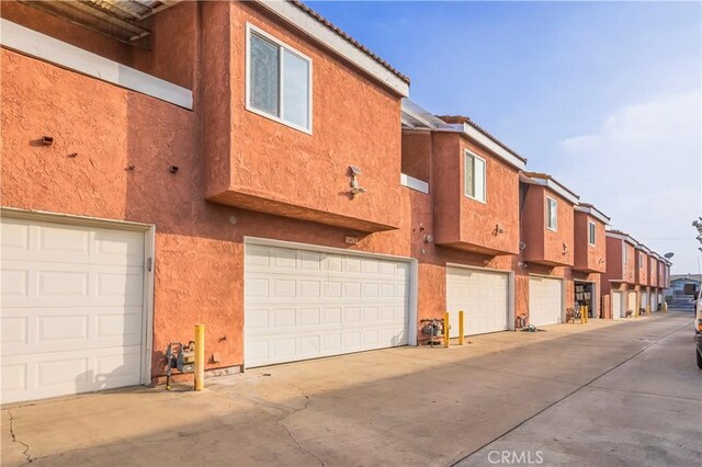 11249 Ferina St, Norwalk, CA 90650 - view of building exterior with an attached garage