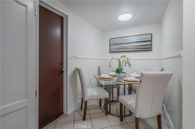 11249 Ferina St, Norwalk, CA 90650 - dining room with tile patterned flooring and baseboards