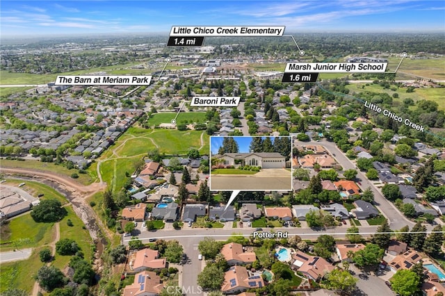 birds eye view of property with a residential view