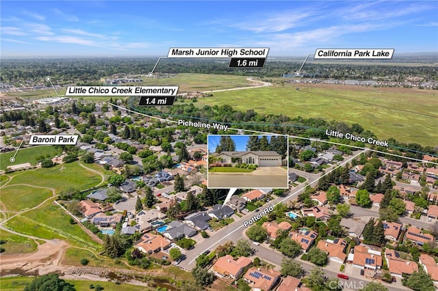 birds eye view of property with a residential view