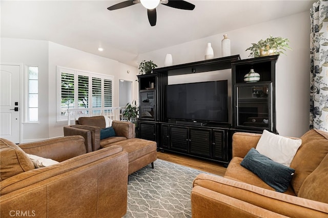 living area featuring a ceiling fan and wood finished floors