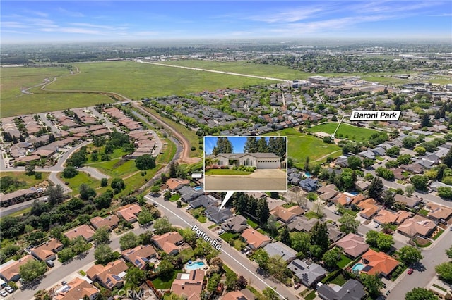 birds eye view of property with a residential view