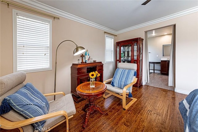 sitting room with wood finished floors, plenty of natural light, and baseboards