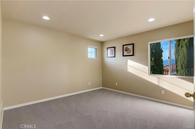 unfurnished room featuring recessed lighting, carpet floors, and baseboards