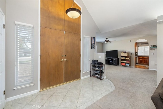 344 E Birch Ave, Hanford, CA 93230 - entrance foyer featuring arched walkways, lofted ceiling, baseboards, and ceiling fan