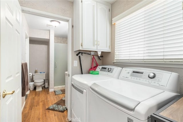 344 E Birch Ave, Hanford, CA 93230 - washroom with washing machine and dryer and light wood-style floors