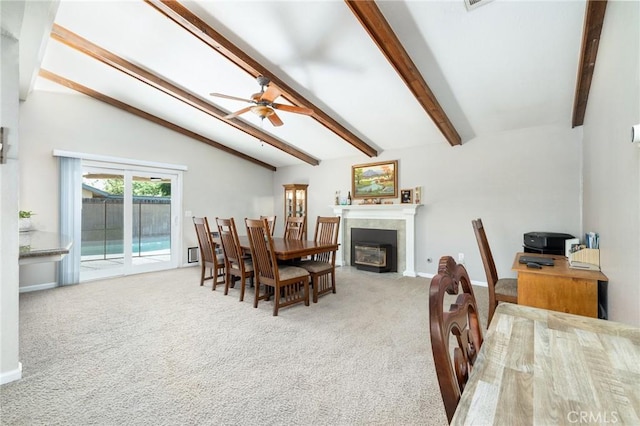 344 E Birch Ave, Hanford, CA 93230 - dining room with a fireplace with flush hearth, lofted ceiling with beams, ceiling fan, and carpet