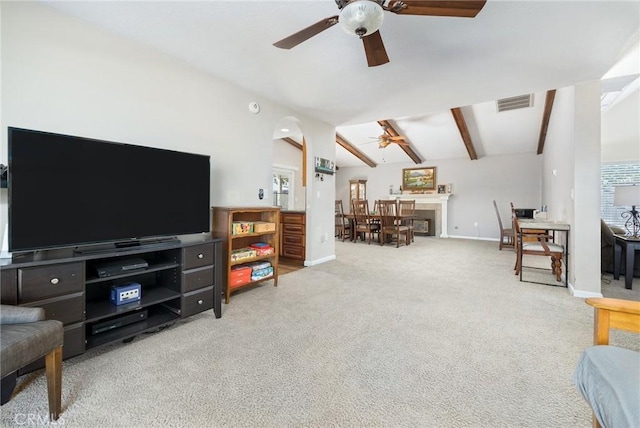 344 E Birch Ave, Hanford, CA 93230 - carpeted living area featuring visible vents, lofted ceiling with beams, baseboards, and ceiling fan