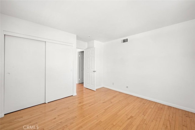 2811 Westbourne Pl, Rowland Heights, CA 91748 - unfurnished bedroom featuring a closet, visible vents, light wood finished floors, and baseboards