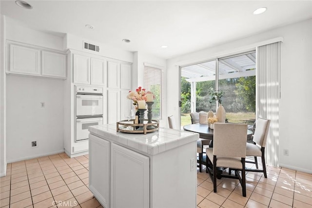 2811 Westbourne Pl, Rowland Heights, CA 91748 - kitchen featuring tile counters, visible vents, white double oven, and light tile patterned flooring
