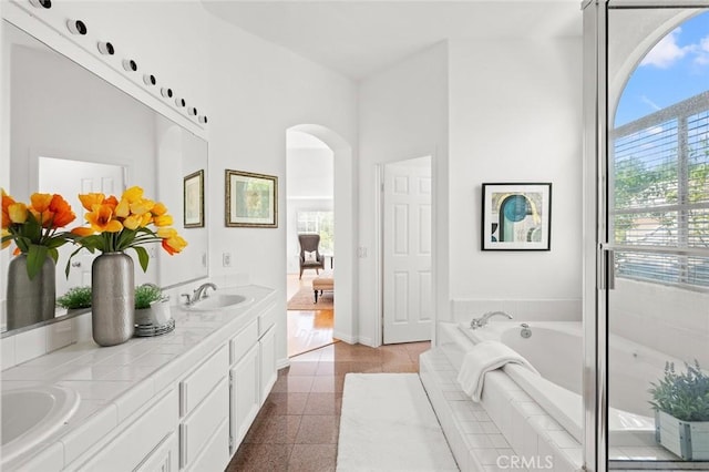 2811 Westbourne Pl, Rowland Heights, CA 91748 - full bathroom with double vanity, a wealth of natural light, a garden tub, and a sink
